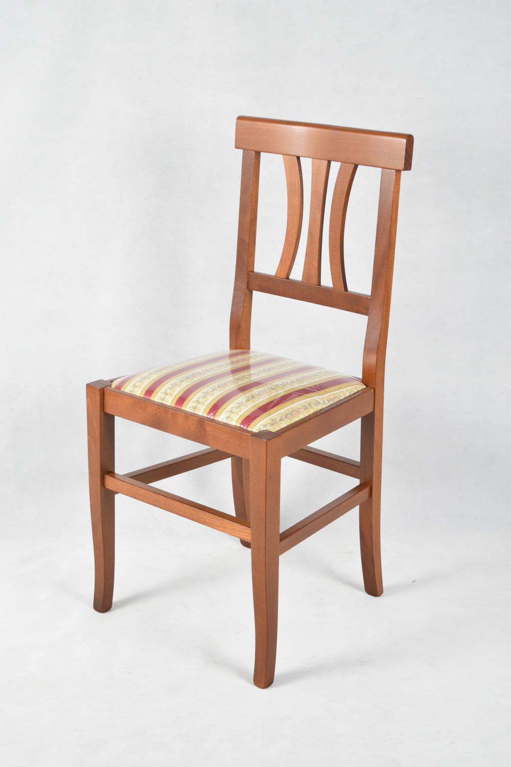 Sedia Artemisia Tommychairs, robusta struttura in legno di faggio color noce chiaro e seduta in tessuto lisere rosso