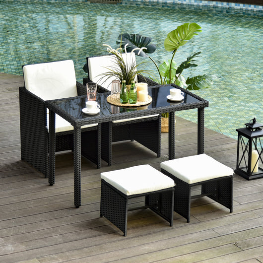 Set Salotto da Giardino in Rattan Sintetico Tavolo 2 Poltrone 2 Poff Nero