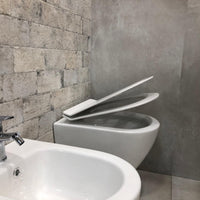 Coppia di Sanitari WC e Bidet Sospesi in Ceramica 48.5x36.5x36.5 cm Rimless Round Bianco